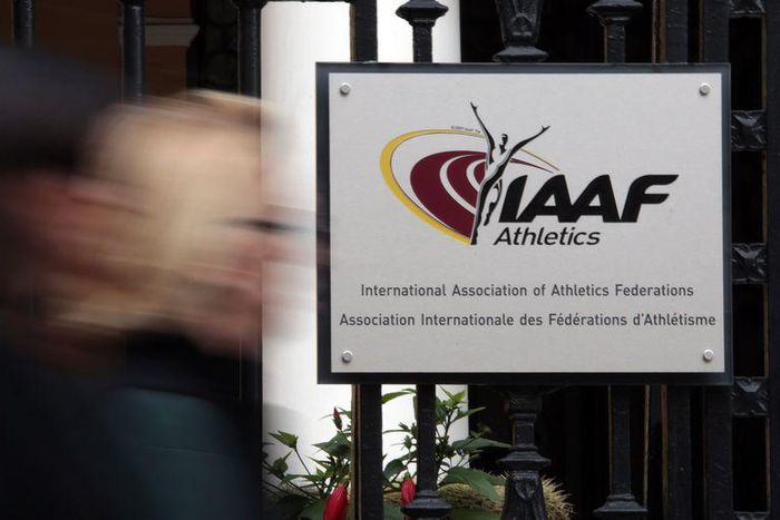 A woman walks past the IAAF (The International Association of Athletics Federations) headquarters in Monaco November 4, 2015. REUTERS/Eric Gaillard