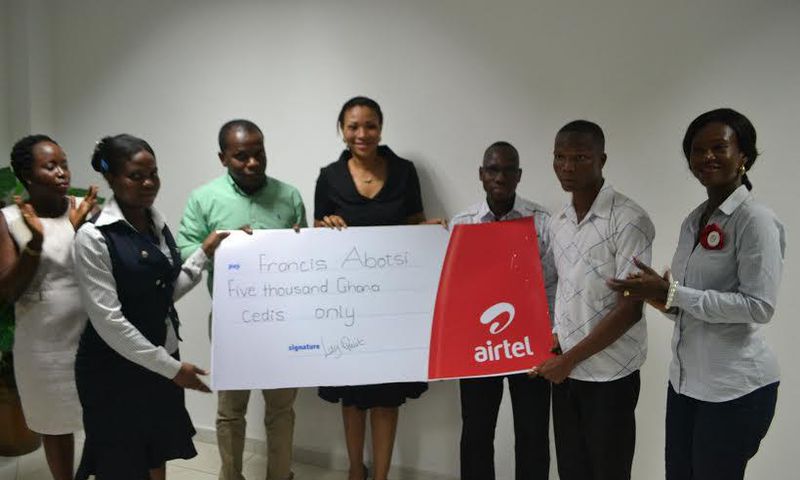 Hannah Agbozo, Legal & Corporate Affairs Director (Middle) and Maruf Lawal, Networks& IT Director (3rd from Left) making the presentation to Mr. Francis Abotsi (2nd from right)