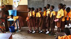 ___4322942___https:______static.pulse.com.gh___webservice___escenic___binary___4322942___2015___11___3___18___students-line-up-in-school-to-wash-hands-accra-ghana