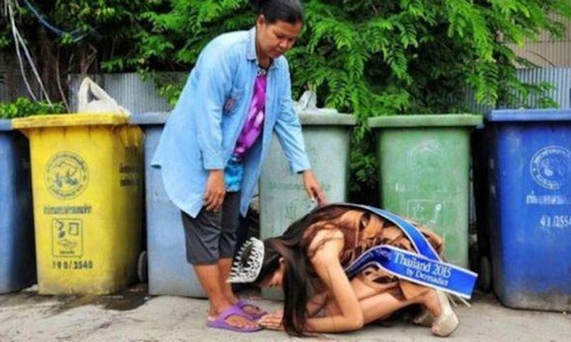 Beauty queen, Khanittha 'Mint' Phasaeng bows before her mum next to a row of wheelie bins