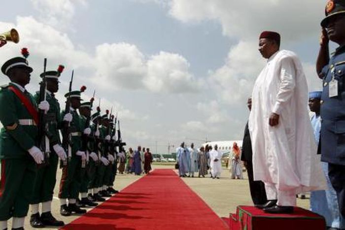 Niger"s President Mahamadou Issoufou inspects the guard of honour upon arrival at the airport in Abuja, Nigeria May 28, 2015.