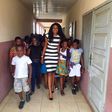 Yvonne Nelson and some pupils of St. Martin De Porres Schoo
