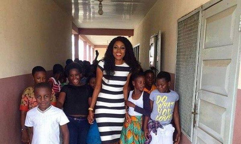 Yvonne Nelson and some pupils of St. Martin De Porres Schoo