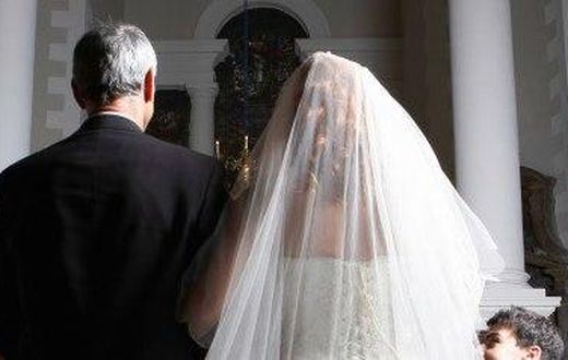 Father walking his daughter down the aisle