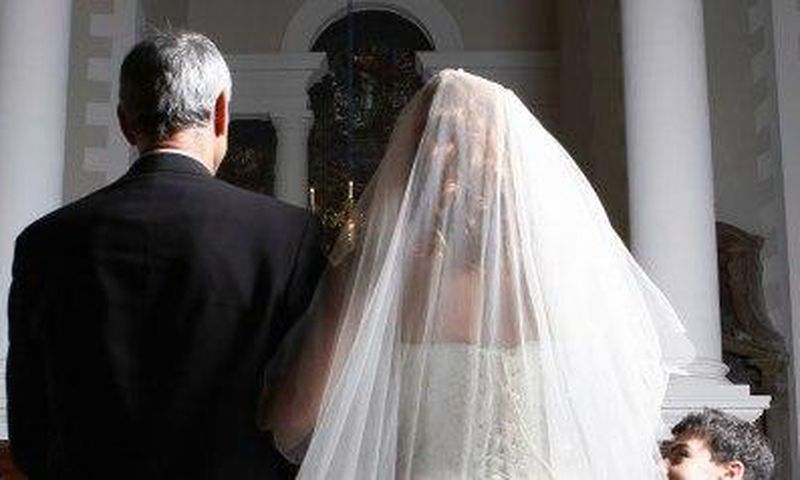 Father walking his daughter down the aisle