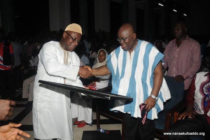 Nana Addo receiving a citation from the Minority Leader, Hon. Osei Kyei-Mensa-Bonsu