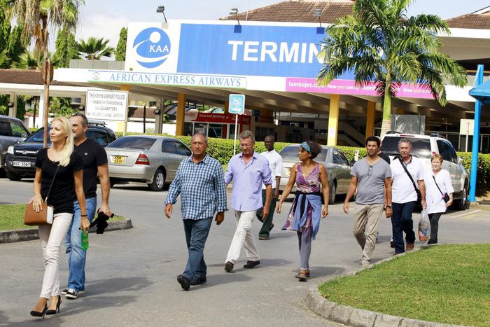 Passengers who were onboard an Air France Boeing 777 aircraft that made an emergency landing are escorted from Moi International Airport in Kenya's coastal city of Mombasa, December 20, 2015.