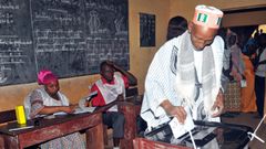 Cellou Binani, AFP | A man votes on February 4, 2018,