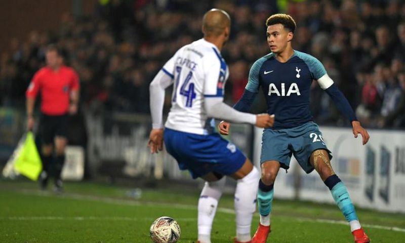 Dele Alli (R), pictured in against Tranmere's Jake Caprice, said Tottenham had "taken their foot off the gas"