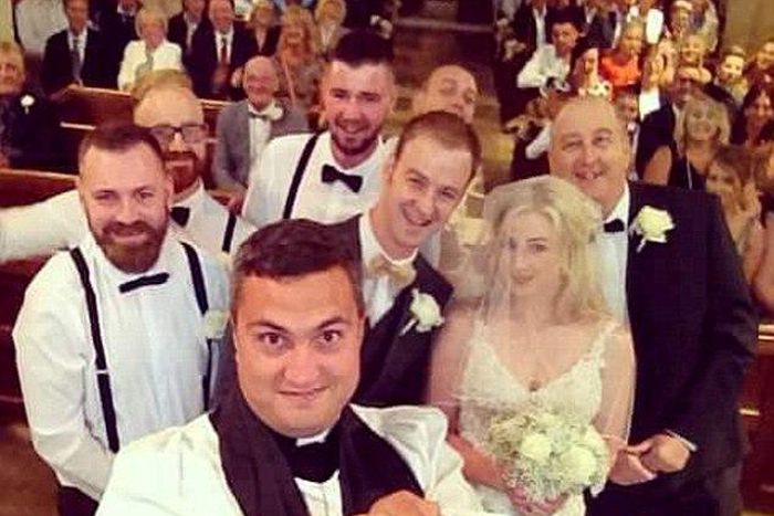 Vicar Paul Frost interrupted the ceremony of bride Emma Scarborough and groom Jamie to take the photograph using a selfie stick and is believed to be the first vicar to perform the stunt