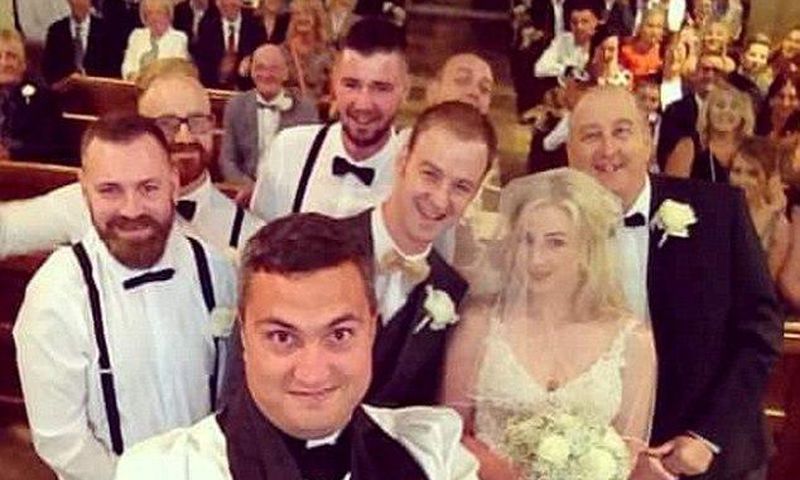 Vicar Paul Frost interrupted the ceremony of bride Emma Scarborough and groom Jamie to take the photograph using a selfie stick and is believed to be the first vicar to perform the stunt