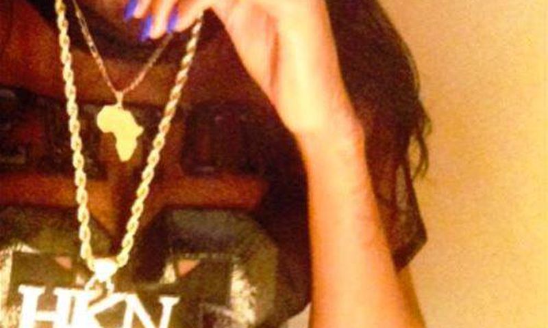 Sira Kante poses with Davido's customized HKN chain