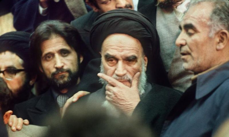 Ayatollah Ruhollah Khomeini surrounded by supporters in Tehran on February 1, 1979, on his return from exile