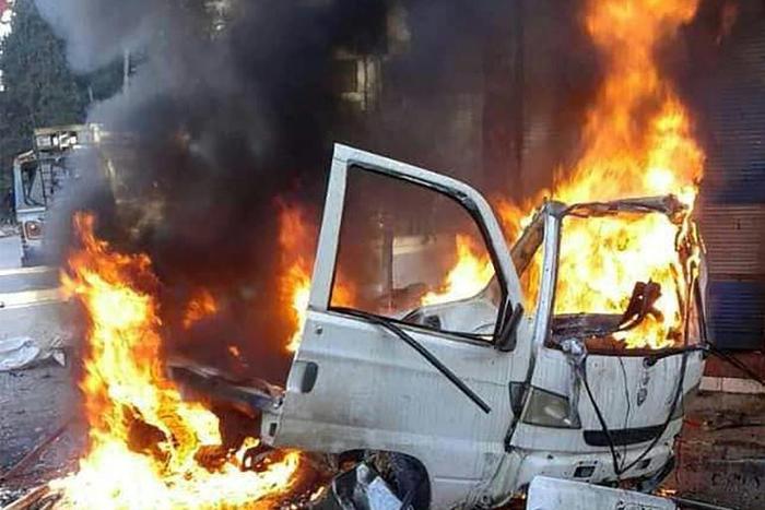 This handout picture made available by Syria's official news agency SANA on January 22, 2019, shows a burning vehicle in the Syrian regime's coastal stronghold of Latakia