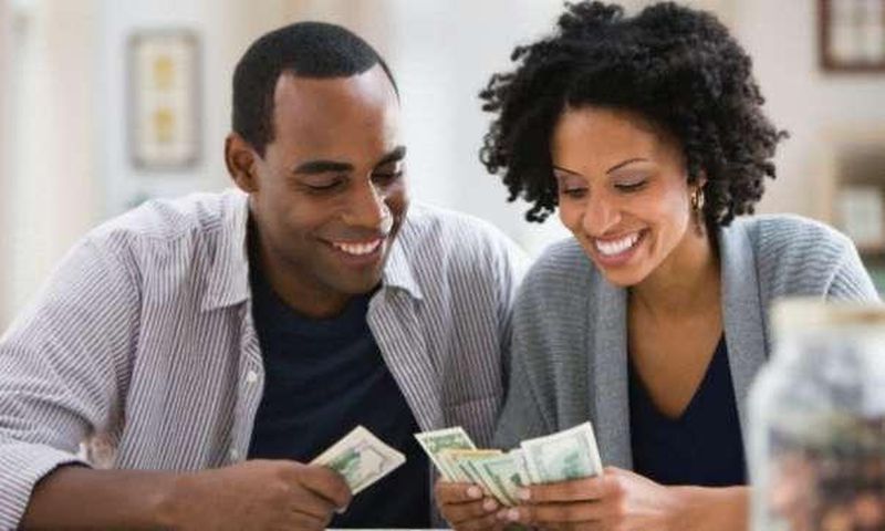 a couple counting money
