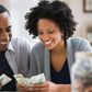 a couple counting money