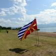 The flags of Greece and Macedonia flutter on the shores of Lake Prespa where last June's historic name deal was signed