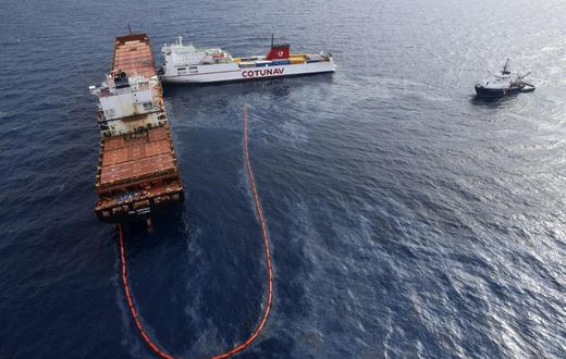 In this file photo taken on October 10, 2018 the French navy ocean tug L'Abeille Flandre (R) approaches two cargo ships - the Tunisian freighter Ulysse (C) and Cyprus-based vessel anchored CLS Virginia (L) - after they collided north of Corsica