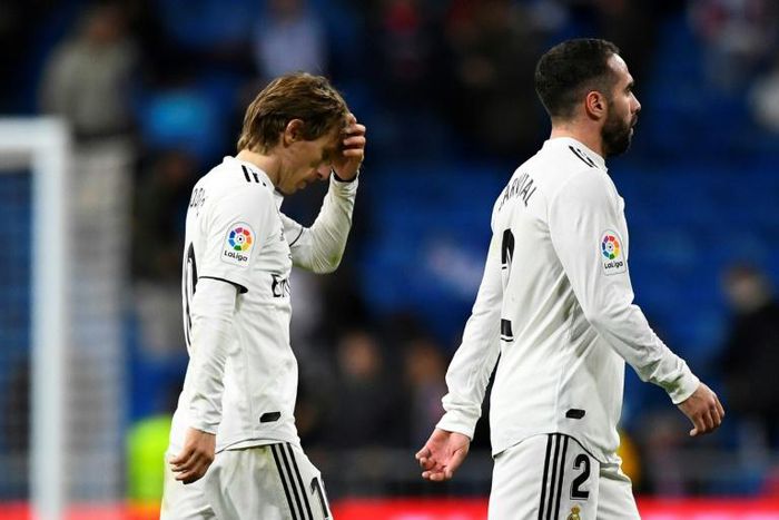 Tough to take: Real Madrid's Luka Modric and Dani Carvajal leave the pitch