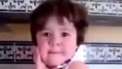 Crying baby girl immediately strikes a pose as soon as she sees a camera