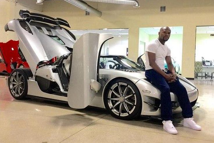 Floyd Mayweather posing with his Koenigsegg CCXR Trevita supercar.