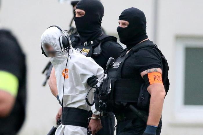 Police officers of a special unit escort Iraqi asylum-seeker Ali Bashar, pictured June 2018, who is accused of beating, raping and then strangling to death a German schoolgirl