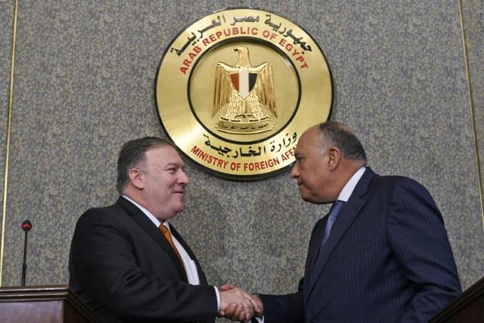 US Secretary of State Mike Pompeo shakes hands after holding a press conference with Egyptian Foreign Minister Sameh Shoukry at the ministry of foreign affairs in Cairo