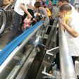Boy dies after getting stuck underneath escalator's handrail