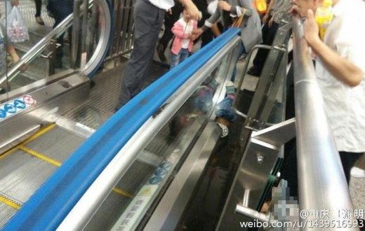 Boy dies after getting stuck underneath escalator's handrail