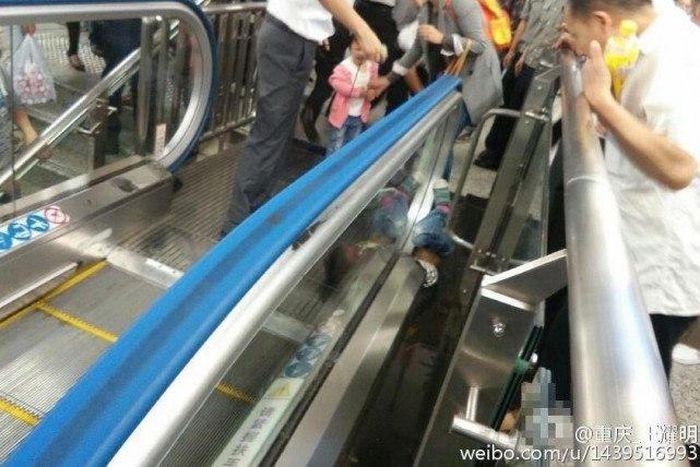 Boy dies after getting stuck underneath escalator's handrail