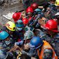 A teenager is carried on a stretcher after being rescued by Nepalese policemen and U.S. rescue workers from a building that collapsed five days after the devastating Earthquake.