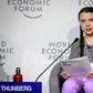 Swedish youth climate activist Greta Thunberg (C) delivers a mesage on climate change at Davos that business executives called "moving" and "inspiring"