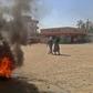 Sudanese protestors burn tyres during an anti-government demonstration on January 18, 2019 in Khartoum