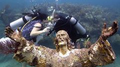 Kimberly Triolet and Jorge Rodriguez got married Tuesday beside the "Christ of the Deep" statue in the Florida Keys