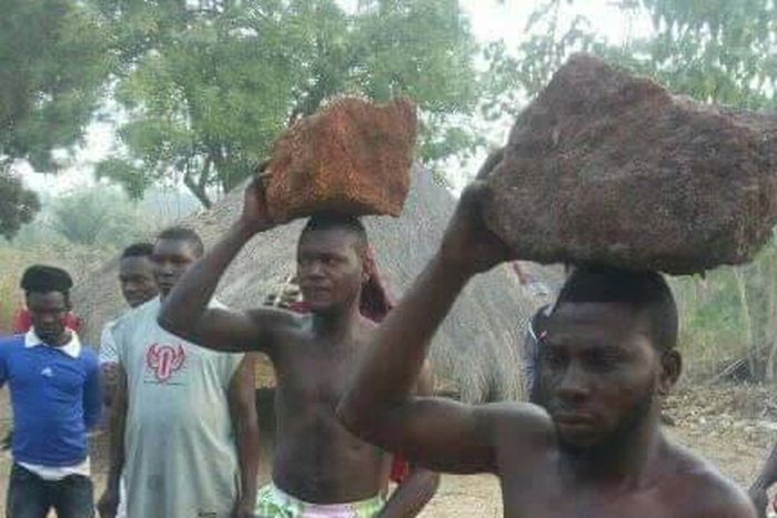Instant justice: Thieves paraded with rocks on their heads as residents whip them