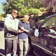Dwayne 'The Rock' Johnson poses with Audie Bridges after bashing his truck's side mirror on his way to movie set
