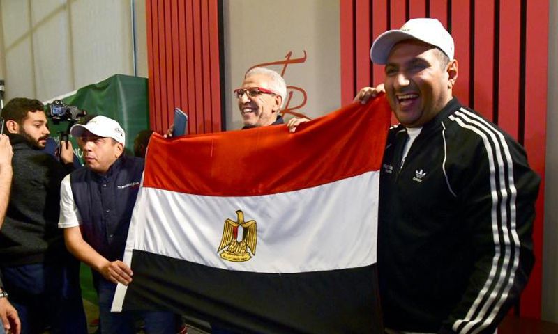 Egyptian representatives celebrate in Dakar after the Confederation of African Football (CAF) executive committee's decision to choose Egypt to host the 2019 Africa Cup of Nations