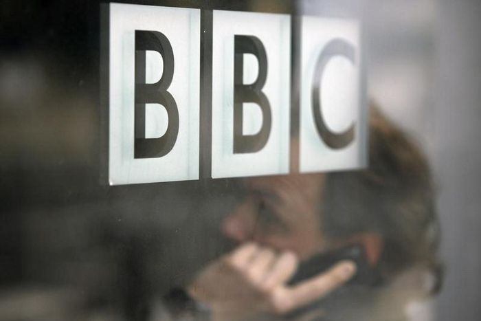 A man talks on a mobile phone inside the BBC headquarters in London November 21, 2008. REUTERS/Andrew Winning