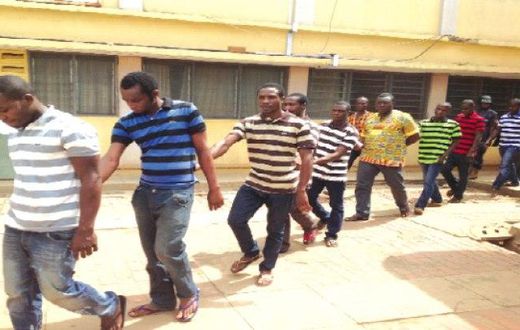 The accused persons being taken away from the court