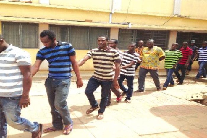 The accused persons being taken away from the court