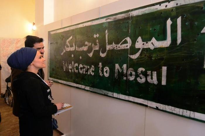 A ‘Welcome to Mosul’ sign on display at an exhibition in the Iraqi city on January 29, 2019