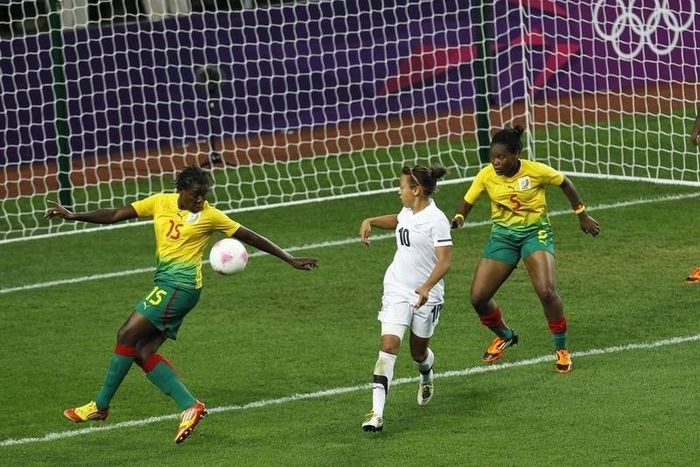 New Zealand's Sarah Gregorius watches as Cameroon's Ysis Sonkeng scores an own goal during their women's football first round Group E match at the City of Coventry Stadium during the London 2012 Olympic Games