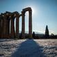 The ancient Temple of Zeus towers over an unusual blanketing of snow on Athens' Acropolis