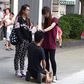 A Chinese woman has been arrested after forcing her boyfriend to kneel in the street and repeatedly slapping him around the face.