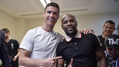 Boxing champion Floyd Mayweather Jr poses with Cristiano Ronaldo