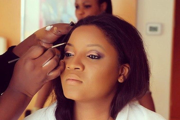 Omotola Jalade-Ekeinde gets her makeup done by Bimpe Onakoya