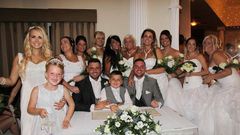 Grooms Deri Rogers and Ben Wood had their ten bridesmaids all dressed up in big white gowns