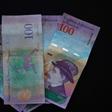 Venezuelan bank notes: the government has devalued the bolivar by nearly 35 percent