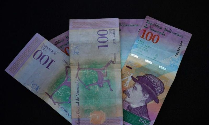 Venezuelan bank notes: the government has devalued the bolivar by nearly 35 percent