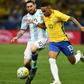 Argentina's Lionel Messi (left) and Brazil's Neymar challenge for the ball in a World Cup qualifier in 2016